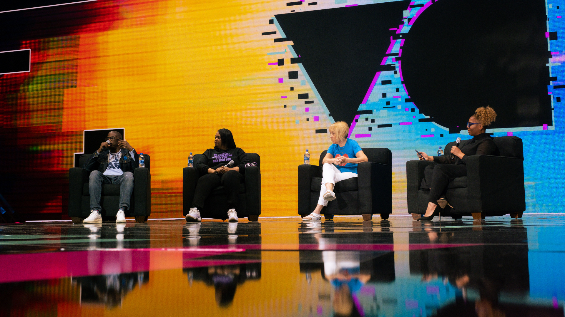 Wendee moderating a CEO panel